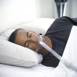Man wearing Oral CPAP Mask